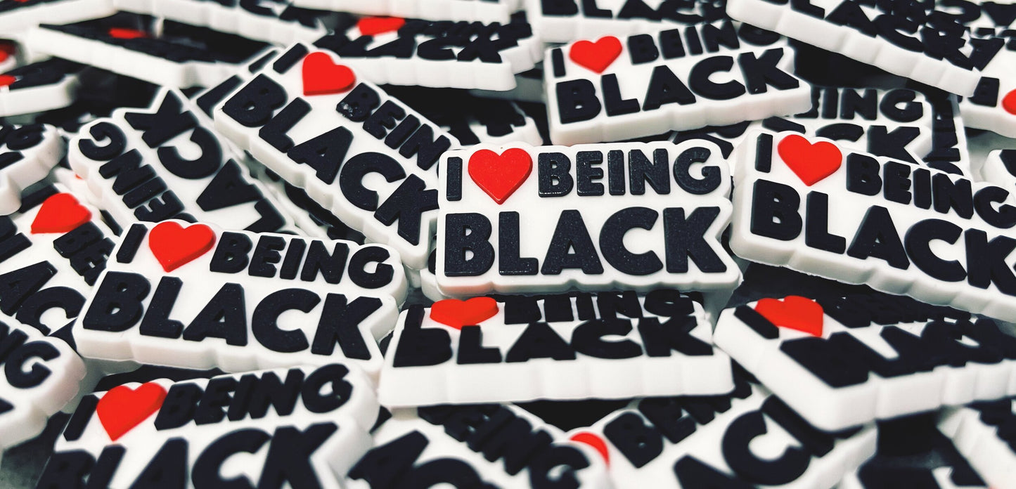 I love being black 1 inch croc shoe charm in the colors white, black, and red.